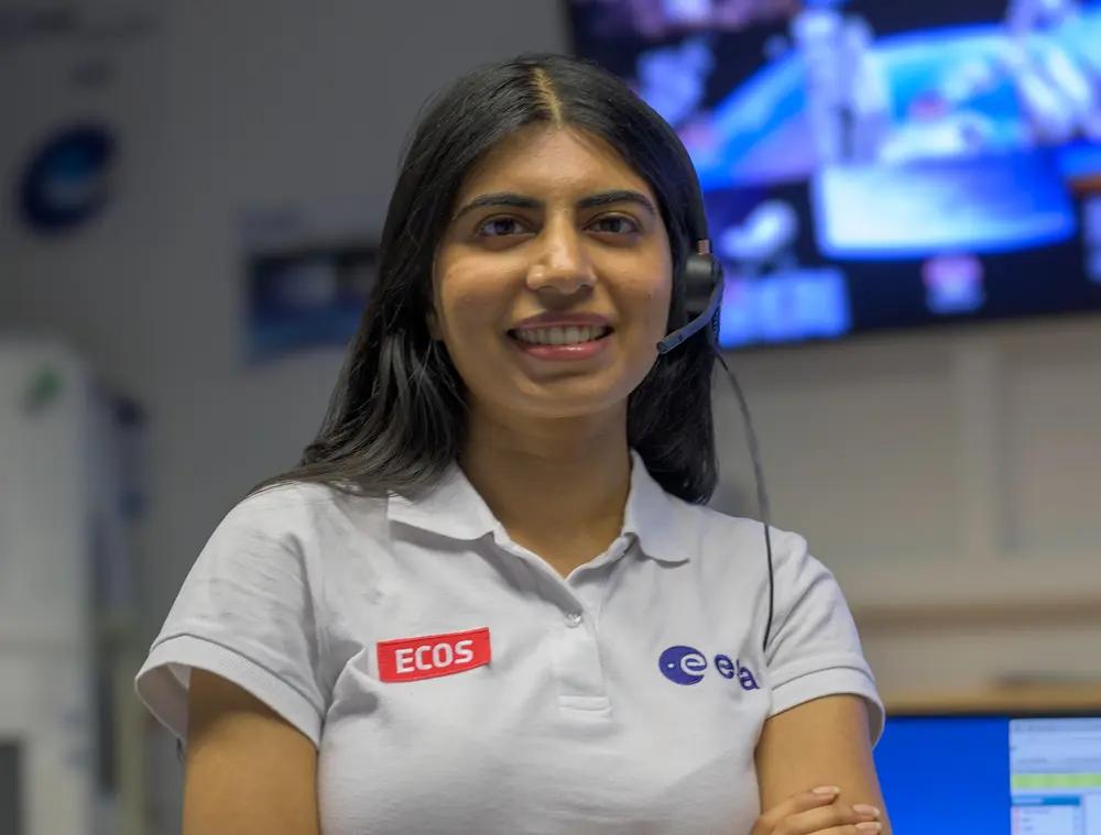 Girl smiling at the camera.